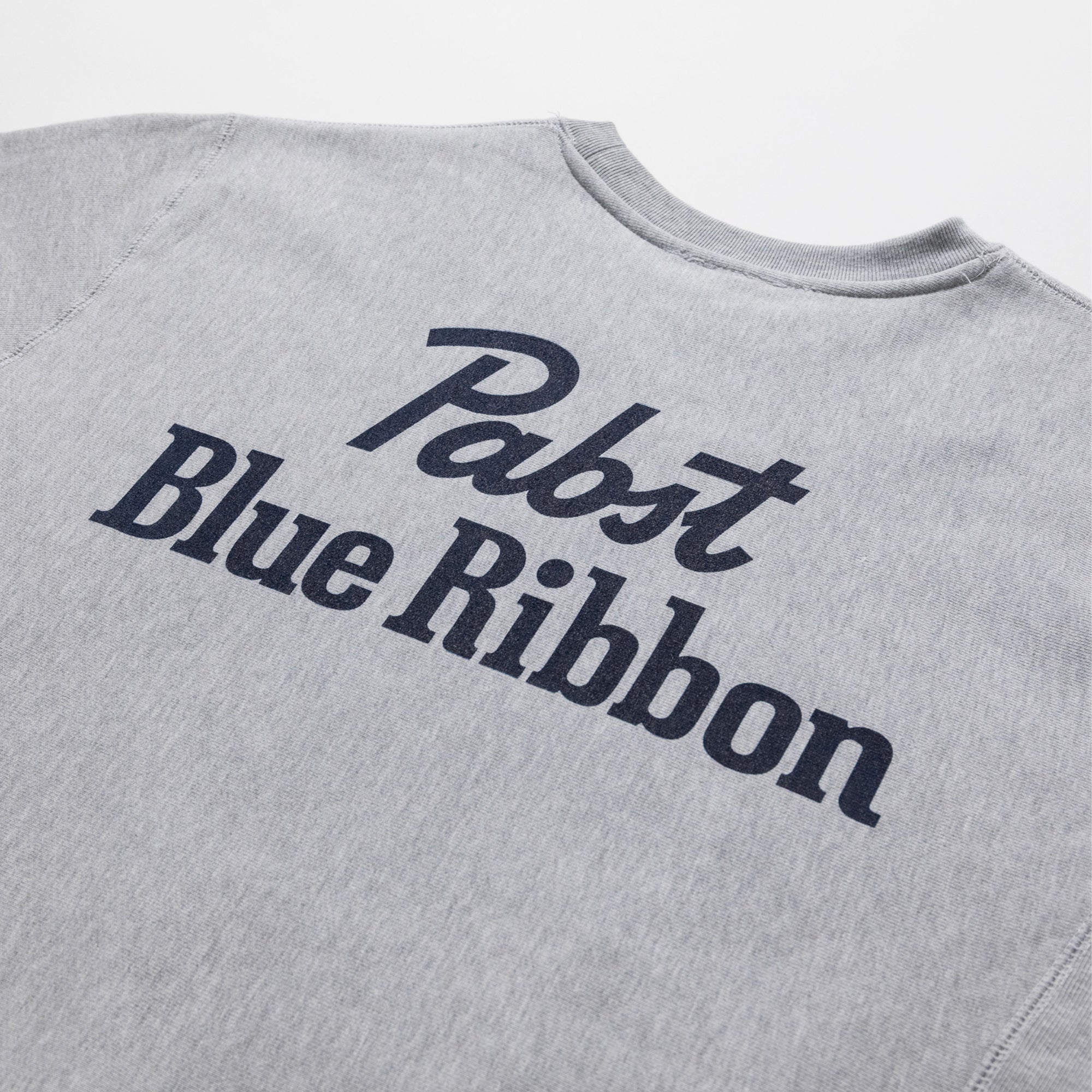 Gray sweatshirt with 'Pabst Blue Ribbon' text on a white background